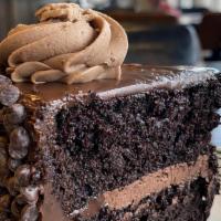 Death By Chocolate Cake · Slice of chocolate cake, chocolate mousse filling, chocolate fudge icing, mini chocolate chi...