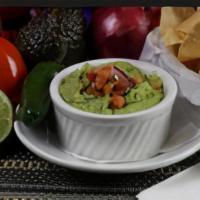 Fresh Guacamole Dip · A blend of avocados, onions, cilantro, tomatoes and fresh lime juice.