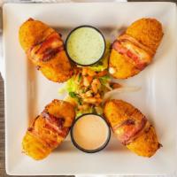 Fronteras Poppers · Four large handmade jalapeño poppers stuffed with ground beef or grilled chicken and cream c...