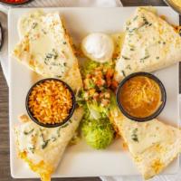 Monterey Quesadilla · Grilled chicken, rice, pico de gallo and Monterey cheddar jack cheese inside a flour tortill...