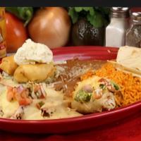 Fronteras Sampler · Grilled chicken, topped with cream cheese Monterey jack cheese, two chimis with cream cheese...