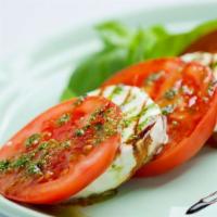 Caprese · Beefsteak tomato, basil, fresh mozzarella, and basil sauce.