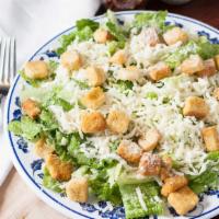 Caesar · Baby romaine, parmesan, croutons, anchovies, and caesar dressing.