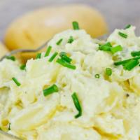 Potato Salad · Potatoes, eggs, carrots, onions, mayonnaise, and fresh parsley.