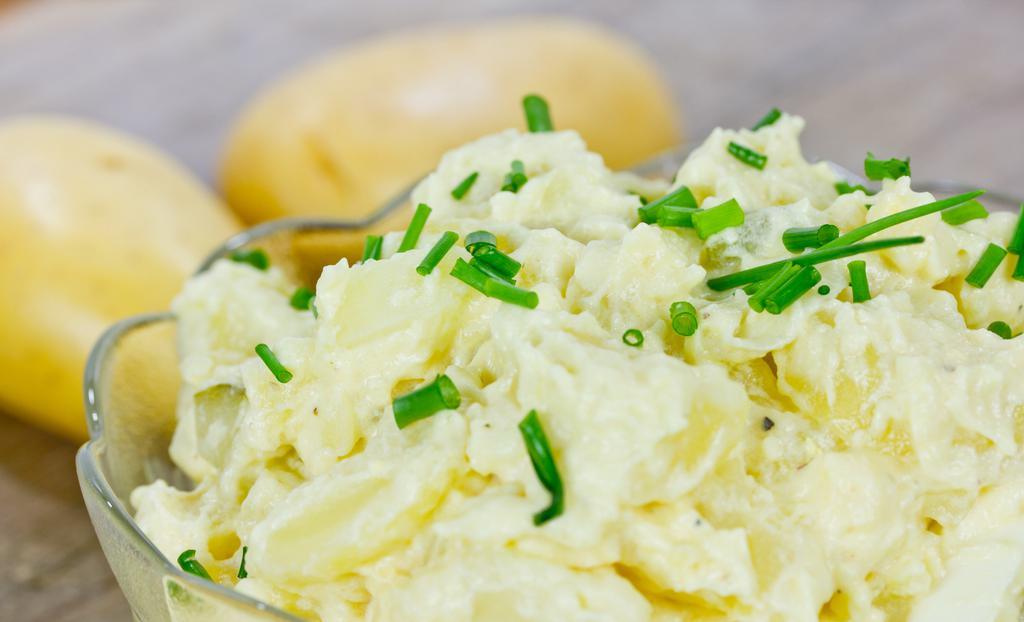 Potato Salad · Potatoes, eggs, carrots, onions, mayonnaise, and fresh parsley.