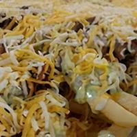 Carne Asada Fries · French fries with refried beans, queso, carne asada, guac sauce, crema (contains nuts) cilan...