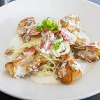 Blu Shrimp · Pan fried shrimp and angel hair pasta tossed with roasted garlic tomatoes in a cream sauce.