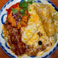 Enchiladas Trio · A beef enchilada with salsa roja, a chicken enchilada with a creamy jalapeño sauce and a che...