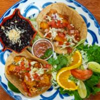 Ensenada Fish Tacos · Crispy battered pescado blanco in soft corn tortillas with cabbage, pico de gallo and a spic...