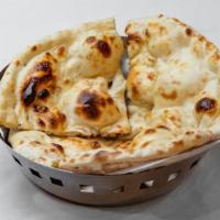 Butter Naan · Leavened bread that is seasoned with fresh butter and baked in tandoor.