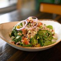 Farro Salad · An ancient grain, rich in protein and fiber! Served with baby kale, tomato, red onion, cucum...