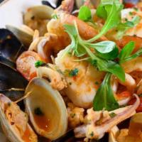 Zuppa Di Pesce · Clams, mussels, shrimp, scallops, and calamari in a spicy tomato broth. Served with a side o...