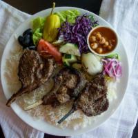 8 Lamb Chops · Lamb chops with rice fresh pita bread paired with our home made cucumber sauce or spicy gree...