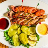 Sausage Plate · A grilled and sliced andouille and two bratwurst sausages with pickles, peppers and BBQ and ...