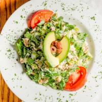 Kelly’S Cobb Salad · Thinly chopped romaine with bacon, chicken, avocado, egg, tomatoes and blue cheese crumbles ...