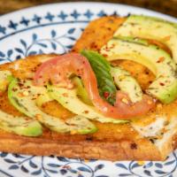 Avocado Toast · Fresh avocado slices, oven-dried tomato aioli, fresh tomato and basil sprinkled with chili f...