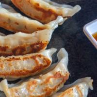 Gyoza (6 Pc) · Pan fried pork dumplings, ponzu salsa.