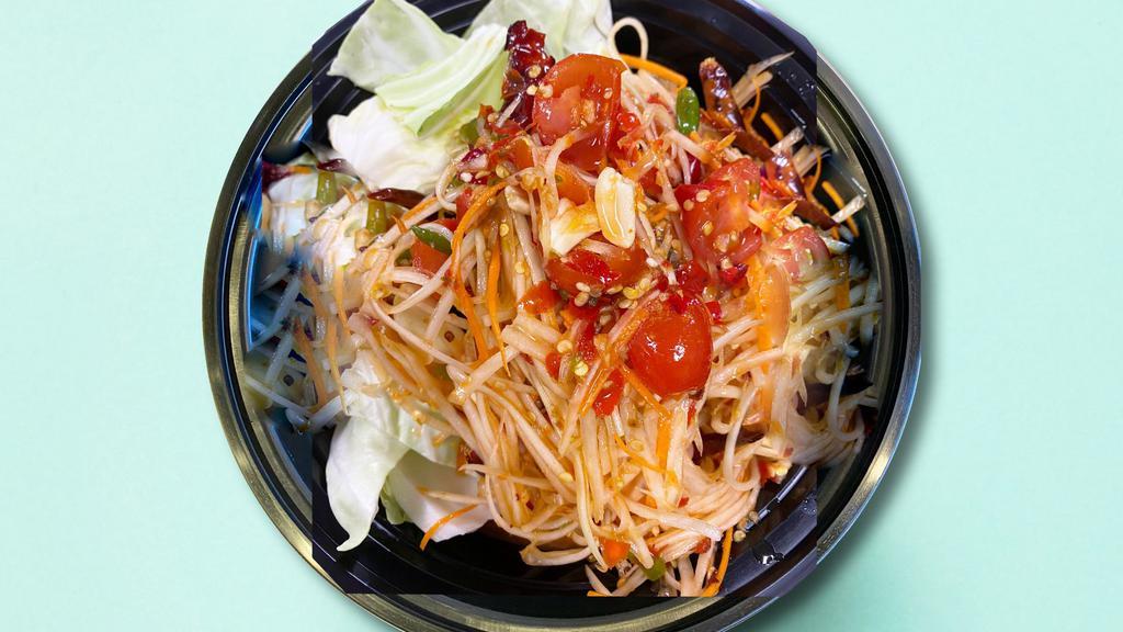 Som-Tam (Papaya Salad) · Shredded green papaya salad with tomato, shredded carrot, green beans, cooked shrimp and peanuts in Thai spicy lime dressing.