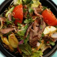 Yum Salad · Your choice of meat, with cucumber, onion, roasted rice, lemongrass, cilantro, and tomato, w...