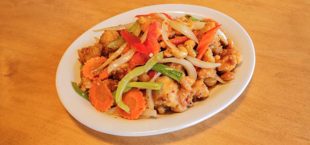 Cashew Chicken · Deep-fried popcorn chicken breast tossed in brown sauce with bell pepper, carrot and onion. Served with rice.