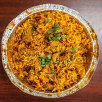 Chicken Biryani · Saffron rice cooked with chicken and spices.