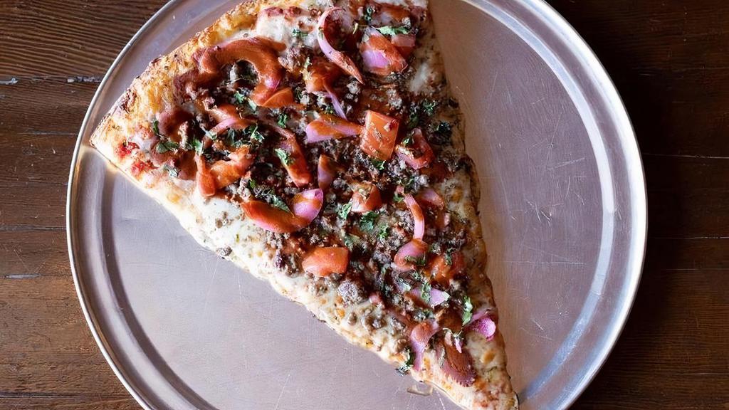 Slice El Patron · Topped with Oven Roasted Ground Beef, Jalapeno, Roma Tomato, Fresh Cilantro, House Pickled Red onion & Valentina Taco Sauce.
