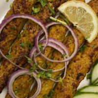 Chicken Seekh Kabab · Succulent minced chicken, shaped on a skewer and blended with herbs and spices.