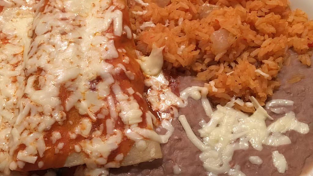 Enchiladas Rojas · Three enchiladas (1 beef, 1 Chicken, 1 Cheese) topped with red sauce, served with rice and beans.