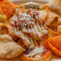 Fiesta Platter · Fiesta platter is served with our popular appetizers, chicken empanada, taco dorado, cheese ...