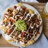 Burnt-End Nachos · House-made queso, jalapeños, sour cream, guacamole, tomato, red onion, KC burnt ends and BBQ...