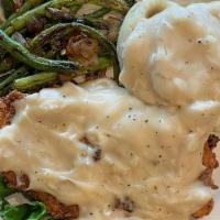 Country Fried Chicken · Chicken breast hand-breaded, and fried, served with mashed potatoes and green beans.