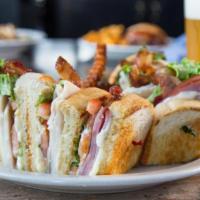 Town Club · Triple decker with turkey, bacon, ham, Cheddar, and jack cheeses, lettuce, tomato, mayo, toa...