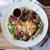 Raspberry Chicken Salad · Grilled chicken, spring mix, blue cheese crumbles, honey walnuts, sliced strawberries. Serve...