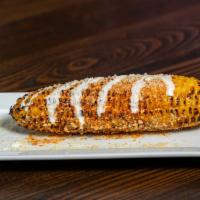 Mexican Street Corn · Mexican Street Corn- Whole grilled corn on the cob rolled in lime, chile, mayo, crema fresca...