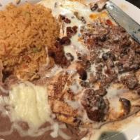 Enchiladas Supremas · Four different enchiladas beef, cheese, bean and chicken. Topped with lettuce, enchilada sau...