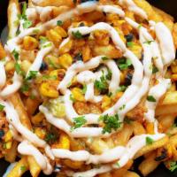 Loaded Queso Fries · House fries, roasted black beans and corn, chuloa lime sour cream drizzle and cilantro.