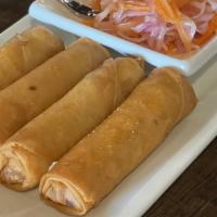 Thai Crispy Rolls · Crispy rice paper rolls filled with vegetables. Served with sweet & sour sauce.