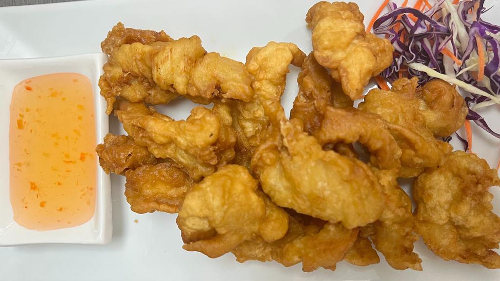Chicken Fingers · Chicken in a light tempura batter and fried to a golden brown. Served with sweet and sour sauce.