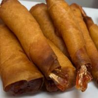 Shrimp Blanket · Marinated shrimp stuffed in egg roll wrappers and deep fried to crispy goodness.