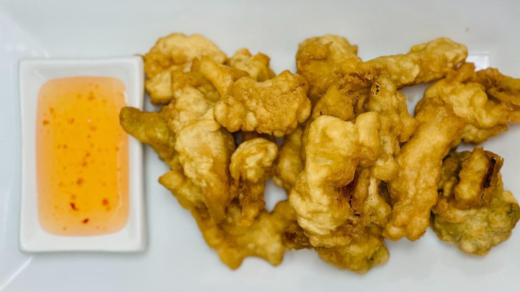 Vegetable Tempura · Fresh vegetables lightly coated in tempura batter and fried to a golden brown. Served with sweet and sour sauce.