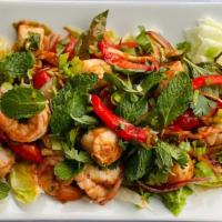 Seafood Yum Yum Salad · Seafood assortment tossed with red onion, fresh peppers, tomatoes, mint leaves, Thai herbs a...