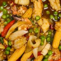 Seafood Madness · Shrimp, scallops and squid simmered in chili sauce with snow peas, baby corn, onions & peppe...