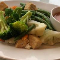 Tofu Rama · Assorted steamed vegetables and tofu with house peanut sauce.