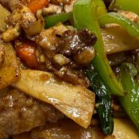 Drunken Noodles · Stir fried wide flat rice noodles with holy basil, onion and bell peppers.