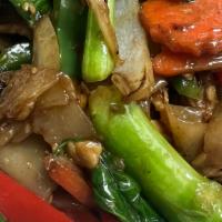 Pad See Ew · Chines greens, sweet soy sauce stir fried with wide flat rice noodles.