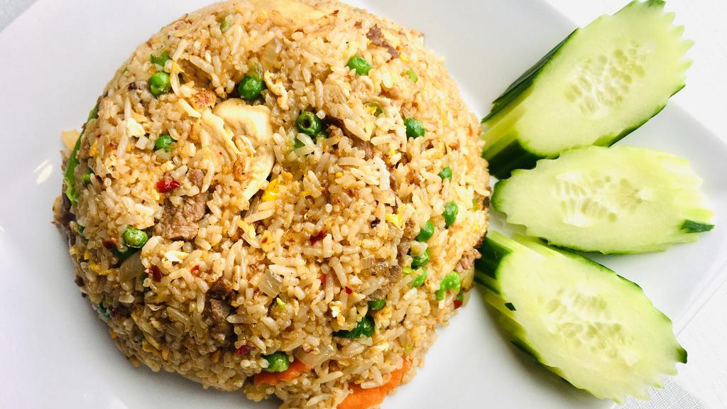 House Fried Rice · Stir-fried rice w/egg, chicken, beef, and pork mixed with assorted vegetables.