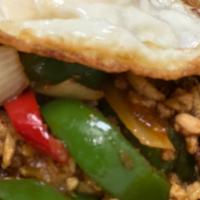 Pad Kra Pao · Minced meat stir-fried holy basil, mushrooms, onions, green peppers and hot chili sauce. Top...
