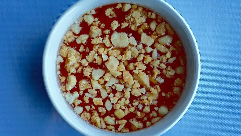 Extra Sweet Chili Sauce · Sweet chili sauce topped with crushed peanuts. Often served with fresh spring rolls. 3.25 oz container.