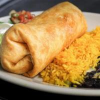 Chimichanga* · A large four tortilla wrapped around your choice of chicken or beef. Then deep-fried until g...
