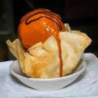Fried Ice Cream · A handcrafted scoop of vanilla ice cream, rolled in a special mixture and fried lightly brow...